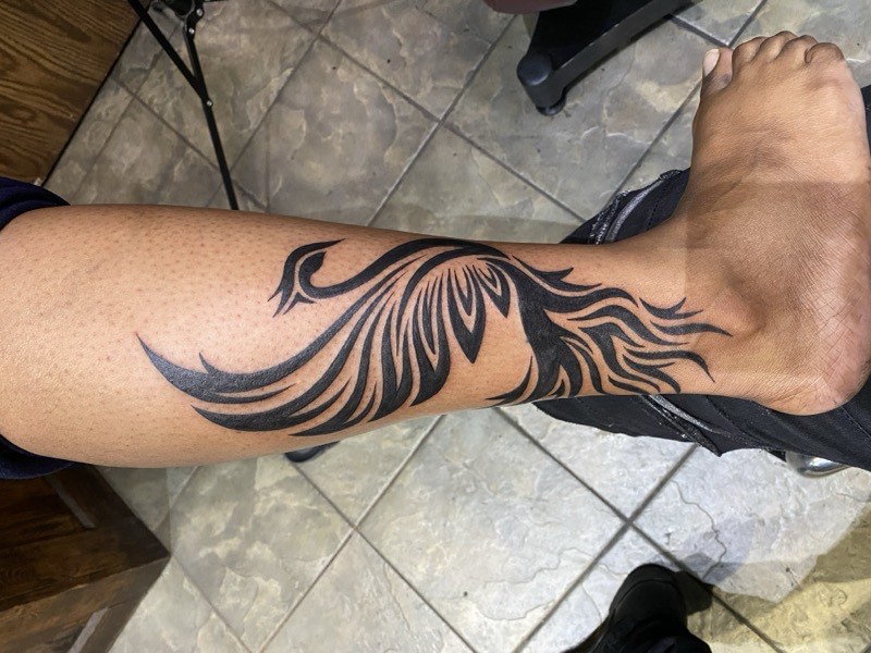 Blackwork tattoo — bold solid fill detail