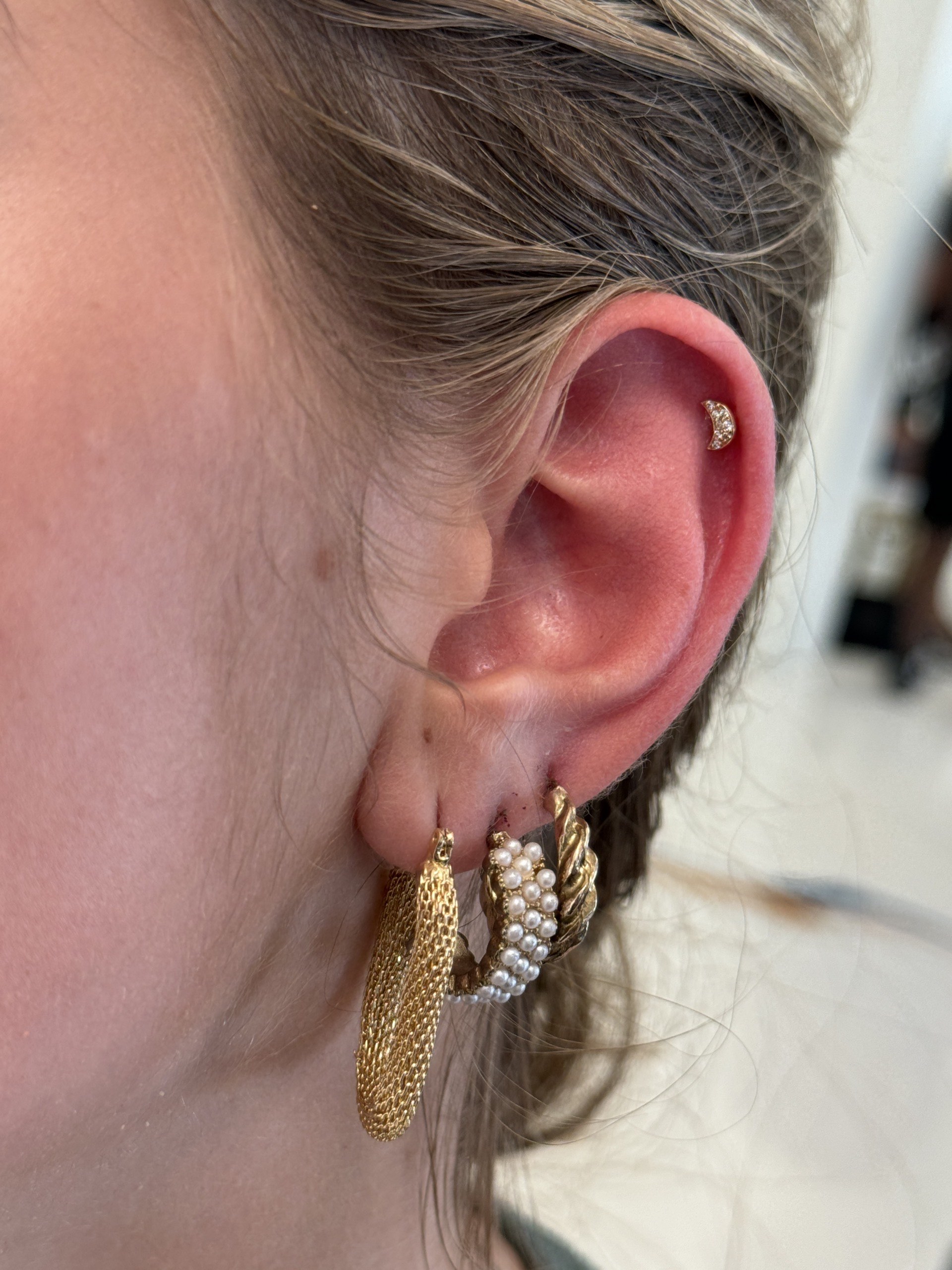 BVLA gold flat back curated piercing at Apollo Studio