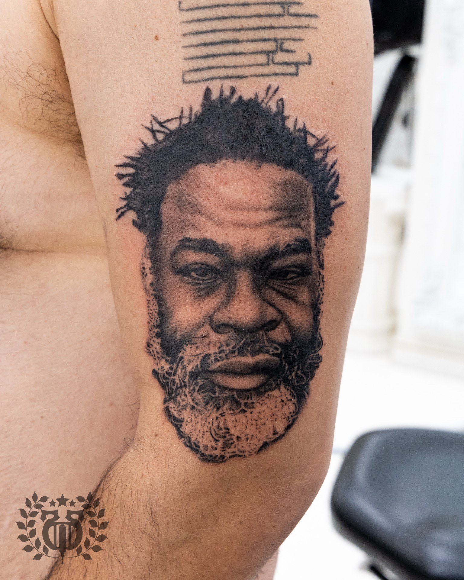 Photorealistic portrait tattoo by Apollo artist in Los Angeles