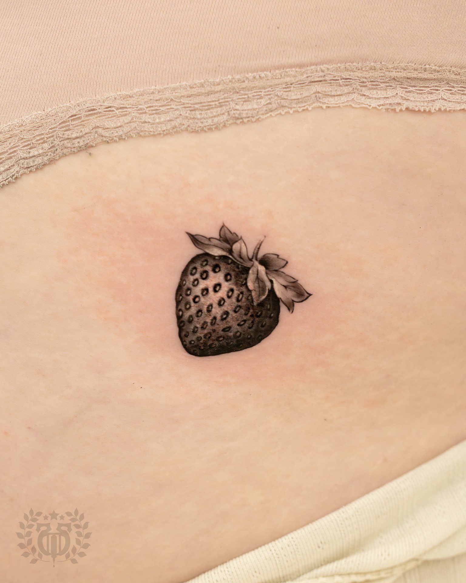 Black and grey realistic strawberry realism tattoo at Apollo Studio Los Angeles