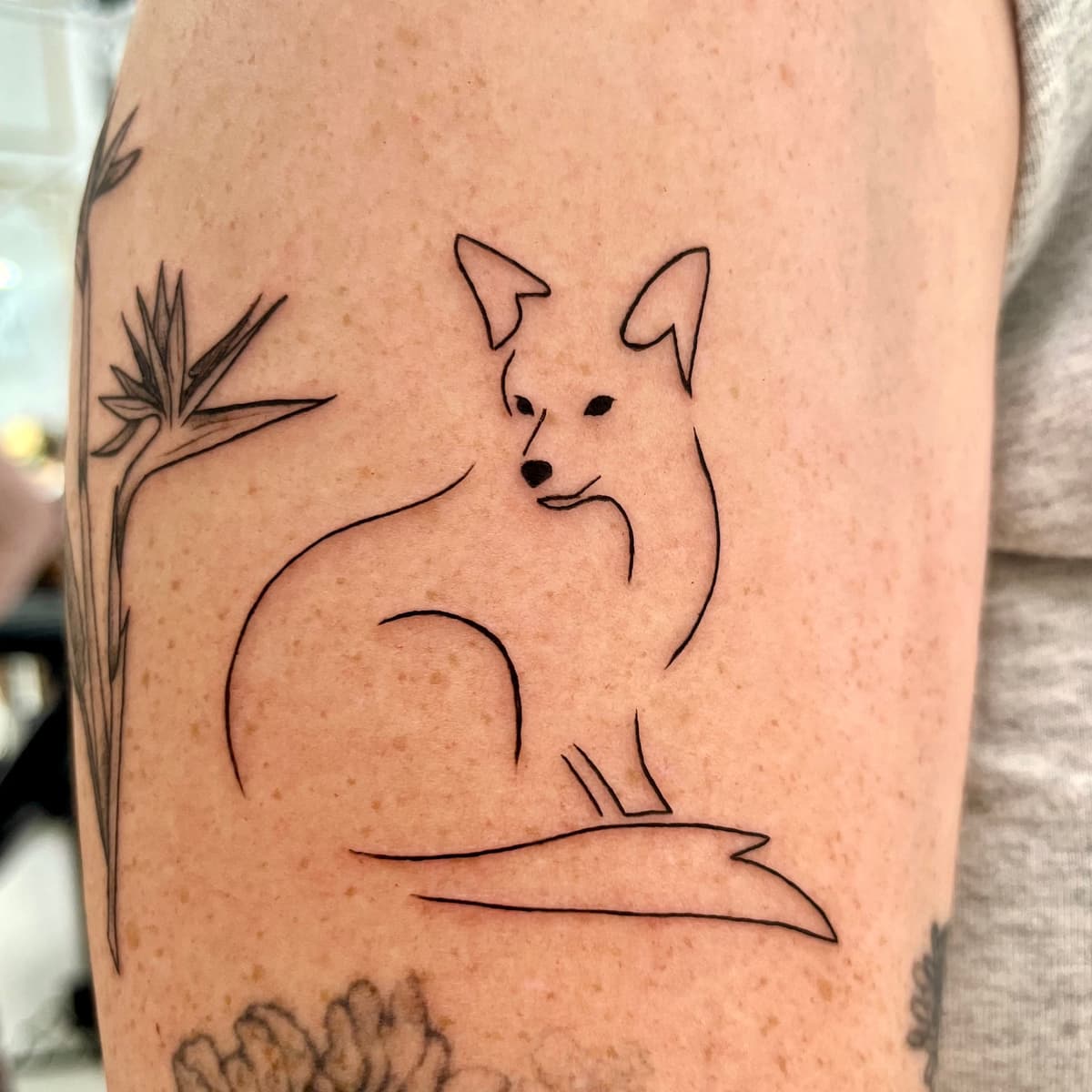 Single needle fox fine line tattoo